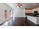 Bright living room with hardwood floors, large windows, and a glass door leading to the backyard at 8475 Douglass Trl, Jonesboro, GA 30236