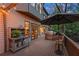 Back deck has a grill, potting table, patio, and french doors leading inside at 3749 Watkins Ne Pl, Brookhaven, GA 30319