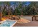 Backyard haven with hot tub, fire pit, and basketball court, creating the perfect outdoor entertainment space at 3749 Watkins Ne Pl, Brookhaven, GA 30319