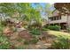 Backyard has a stone path, mature trees, landscaping, and a play set at 3749 Watkins Ne Pl, Brookhaven, GA 30319