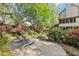 Beautiful backyard features lush landscaping, a patio with lounge chairs, and scenic views for outdoor enjoyment at 3749 Watkins Ne Pl, Brookhaven, GA 30319
