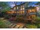 Expansive backyard featuring a deck, patio, and lush landscaping, ideal for outdoor entertaining and relaxation at 3749 Watkins Ne Pl, Brookhaven, GA 30319
