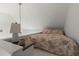 Cozy bedroom loft with sloped ceiling and a reading lamp at 3749 Watkins Ne Pl, Brookhaven, GA 30319