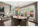 Open-concept dining area adjacent to living room with bright lighting and decor at 3749 Watkins Ne Pl, Brookhaven, GA 30319