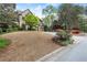 Brick home exterior with a three car garage, manicured lawn and plantings in a desirable suburban neighborhood at 3749 Watkins Ne Pl, Brookhaven, GA 30319