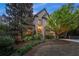 Elegant brick home showcasing manicured landscaping, mature trees, and a welcoming front entrance at 3749 Watkins Ne Pl, Brookhaven, GA 30319