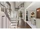 Welcoming foyer featuring a grand staircase, hardwood floors, and elegant decor, perfect for making a lasting impression at 3749 Watkins Ne Pl, Brookhaven, GA 30319