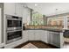 Bright kitchen with stainless steel appliances, sleek countertops, and plenty of natural light at 3749 Watkins Ne Pl, Brookhaven, GA 30319