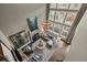 Inviting living room featuring a fireplace, large windows, hardwood floors, and chandelier at 3749 Watkins Ne Pl, Brookhaven, GA 30319