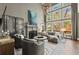 Bright living room with a fireplace, large windows, and elegant decor provides a comfortable space at 3749 Watkins Ne Pl, Brookhaven, GA 30319