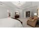 Spacious main bedroom with tray ceiling, chandelier, sitting area, and access to ensuite bath at 3749 Watkins Ne Pl, Brookhaven, GA 30319