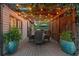 Cozy covered patio with dining set and stylish planters at 3749 Watkins Ne Pl, Brookhaven, GA 30319