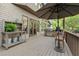 A spacious outdoor kitchen features a built-in grill and stainless steel appliances, perfect for entertaining at 3749 Watkins Ne Pl, Brookhaven, GA 30319
