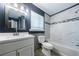 Bathroom features modern vanity, tub with shower, tile accents, and natural light at 5287 Chantilly Ter, Atlanta, GA 30349