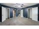 Carpeted bedroom features neutral decor, with closets and access to other rooms at 5287 Chantilly Ter, Atlanta, GA 30349