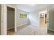 Bedroom features neutral walls, neutral carpet, a closet and stairs to the next floor at 5287 Chantilly Ter, Atlanta, GA 30349