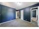 Bedroom with neutral carpet, blue walls, and white doors at 5287 Chantilly Ter, Atlanta, GA 30349