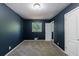 Bedroom with neutral carpet, and a white door at 5287 Chantilly Ter, Atlanta, GA 30349