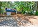 A two-story brick and siding home with a large front yard and driveway at 5287 Chantilly Ter, Atlanta, GA 30349