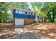 Charming home with a brick facade, attached garage, and well-manicured front lawn and landscaping at 5287 Chantilly Ter, Atlanta, GA 30349