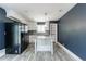Eat-in kitchen features stainless steel appliances, tile backsplash, and a breakfast bar at 5287 Chantilly Ter, Atlanta, GA 30349