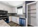 Bright kitchen features stainless steel appliances, tile backsplash, and a walk-in pantry at 5287 Chantilly Ter, Atlanta, GA 30349