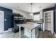 Eat-in kitchen features stainless steel appliances, tile backsplash, and a breakfast bar at 5287 Chantilly Ter, Atlanta, GA 30349