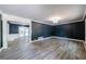 Spacious living room features hardwood floors, modern lighting, and neutral decor at 5287 Chantilly Ter, Atlanta, GA 30349
