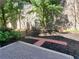 A landscaped backyard features a brick patio surrounded by mulch at 595 Broadview Ne Pl, Atlanta, GA 30324