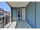 A bright balcony with a door and a black railing offers views of the neighborhood at 595 Broadview Ne Pl, Atlanta, GA 30324