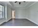 Bedroom featuring hardwood floors and a door to the bath at 595 Broadview Ne Pl, Atlanta, GA 30324