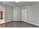 An empty bedroom with hardwood floors and neutral colored walls and white trim at 595 Broadview Ne Pl, Atlanta, GA 30324