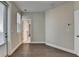 Bedroom featuring hardwood floors, bright windows, and a doorway to another part of the home at 595 Broadview Ne Pl, Atlanta, GA 30324