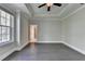 Spacious bedroom with hardwood floors, ceiling fan, and natural light at 595 Broadview Ne Pl, Atlanta, GA 30324