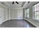Bedroom featuring hardwood floors, large windows, and tray ceiling at 595 Broadview Ne Pl, Atlanta, GA 30324