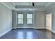 Spacious bedroom with tray ceiling, dark wood floors and windows at 595 Broadview Ne Pl, Atlanta, GA 30324