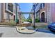 Community entrance with stone steps, lush landscaping, and decorative pergola at 595 Broadview Ne Pl, Atlanta, GA 30324