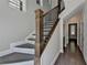 Attractive entryway with hardwood floors, a staircase with iron accents, and contemporary design at 595 Broadview Ne Pl, Atlanta, GA 30324