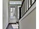 Hallway entrance featuring hardwood floors, a staircase, and natural light from a nearby window at 595 Broadview Ne Pl, Atlanta, GA 30324