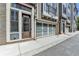 Townhouse with a modern garage door and brick exterior, with easy access to the front door at 595 Broadview Ne Pl, Atlanta, GA 30324