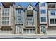 Attractive townhouse with brick and siding exterior, front-entry garage, and second-story balcony at 595 Broadview Ne Pl, Atlanta, GA 30324