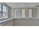 Bright upstairs hallway with windows and white trim at 595 Broadview Ne Pl, Atlanta, GA 30324