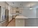 Bright kitchen featuring a large island, stainless steel appliances, and modern cabinetry at 595 Broadview Ne Pl, Atlanta, GA 30324