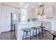 Well-lit kitchen with a spacious island, stainless steel appliances, and bar stool seating at 595 Broadview Ne Pl, Atlanta, GA 30324