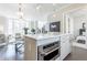 Stylish kitchen featuring an island with built-in oven, connecting seamlessly with the living area and bedroom at 595 Broadview Ne Pl, Atlanta, GA 30324