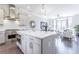 Bright, open kitchen featuring a large island, stainless steel appliances, and seamless flow into the living area at 595 Broadview Ne Pl, Atlanta, GA 30324