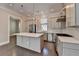 Gourmet kitchen with stainless appliances, an island, pendant lights, and an open floor plan at 595 Broadview Ne Pl, Atlanta, GA 30324