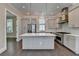 Bright kitchen featuring a large island, stainless steel appliances, and modern cabinetry at 595 Broadview Ne Pl, Atlanta, GA 30324