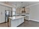 Bright kitchen featuring a large island, stainless steel appliances, and modern cabinetry at 595 Broadview Ne Pl, Atlanta, GA 30324
