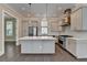 Bright kitchen featuring a large island, stainless steel appliances, and modern cabinetry at 595 Broadview Ne Pl, Atlanta, GA 30324